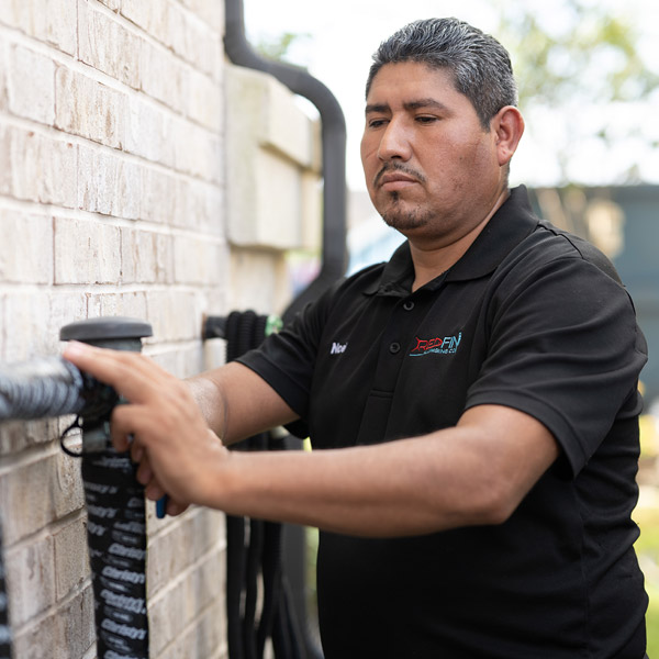 Technician inspecting drain pipes, Houston & Katy, TX